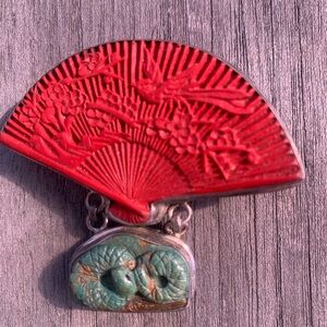 Red Carved Fan Pendant with Green carved snake.